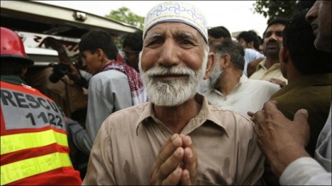 Elderly man grieves after the May 2010 attack on the Ahmadi mosque in Lahore. File photo